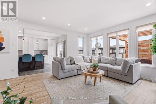 Seamless flow from kitchen to living area - 210 Pingwi Place, Ottawa, ON 