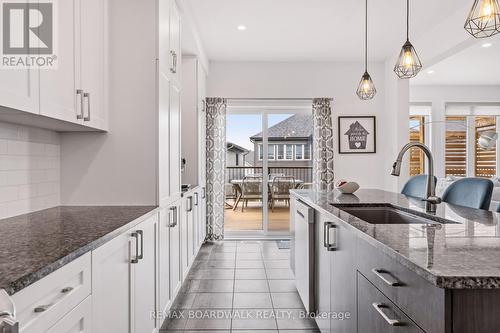 Direct kitchen access to the elevated deck - 210 Pingwi Place, Ottawa, ON 