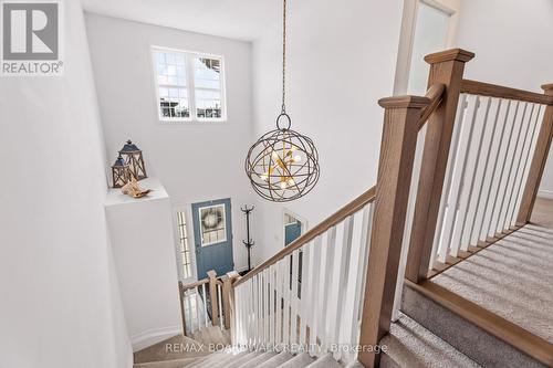 Open staircase filled with natural light - 210 Pingwi Place, Ottawa, ON 