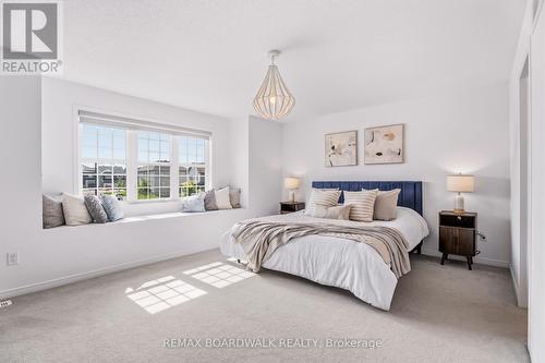 Spacious primary bedroom with natural light - 210 Pingwi Place, Ottawa, ON 