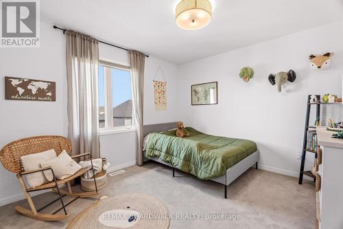 Generously sized secondary bedroom - 210 Pingwi Place, Ottawa, ON 