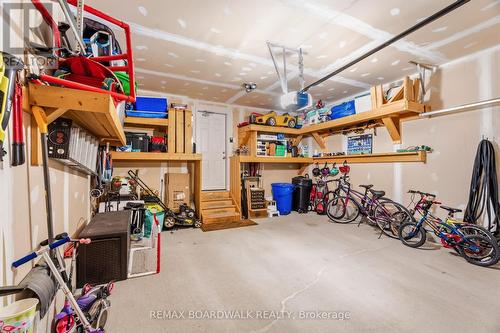Double garage with custom built-in shelving - 210 Pingwi Place, Ottawa, ON 