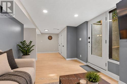 Lower-level secondary unit living and entry area - 5 Rayburn Street, Ottawa, ON 