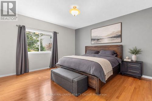 Primary bedroom with hardwood floors - 5 Rayburn Street, Ottawa, ON 