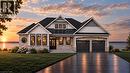 Stone and siding exterior with a dark shingle roof, featuring multiple gables and a front dormer - 100 Watershore Drive Unit# 19, Stoney Creek, ON 