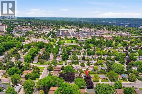 Suburban neighborhood with mature trees, established residential properties, and distant commercial structures - 312 Upper Paradise Road, Hamilton, ON 