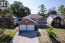 Brick exterior with a double garage - 12 Langevin Drive, Wasaga Beach, ON 