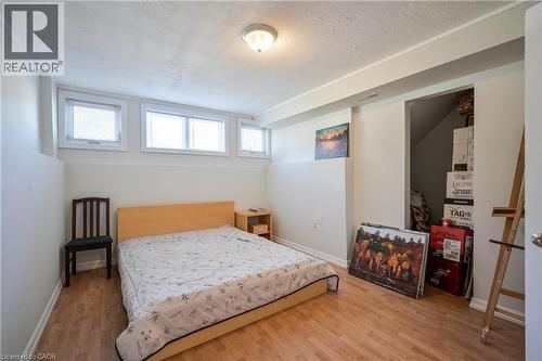 Recessed lighting, wood-finish flooring, and white walls create a neutral palette - 12 Langevin Drive, Wasaga Beach, ON 