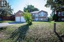 Brick exterior with white trim - 12 Langevin Drive, Wasaga Beach, ON 