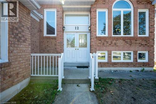 Brick exterior with white trim windows - 12 Langevin Drive, Wasaga Beach, ON 