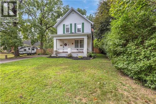 White siding exterior with green window shutters - 11 Tutela Heights Road, Brantford, ON 
