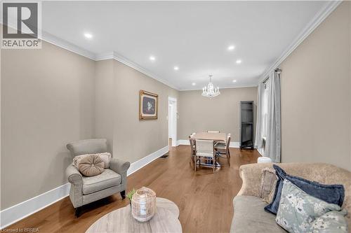 Hardwood flooring throughout, recessed lighting, crown molding, and a chandelier fixture - 11 Tutela Heights Road, Brantford, ON 