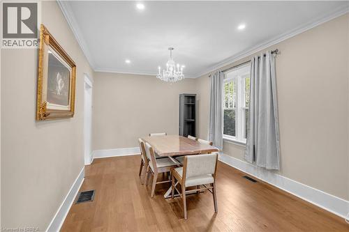 Warm wood-finish flooring with crisp white baseboards and crown molding - 11 Tutela Heights Road, Brantford, ON 