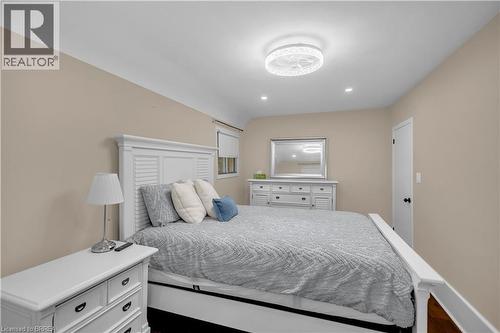 Recessed lighting, ceiling-mounted light fixture, neutral wall color, wood-finish flooring, white door with black hardware - 11 Tutela Heights Road, Brantford, ON 