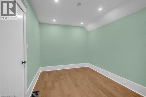 Recessed lighting, light wood-finish flooring, white trim, and a white interior door - 11 Tutela Heights Road, Brantford, ON 