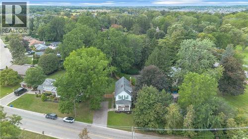 Two-story residence with a white exterior and light green shutters - 11 Tutela Heights Road, Brantford, ON 