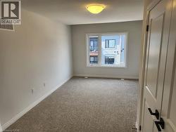 Neutral paint palette with wall-to-wall carpeting - 