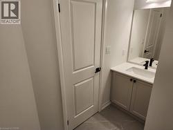 White shaker-style vanity with a white countertop and integrated sink - 