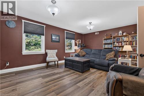 Spacious room featuring wood-finish flooring and two distinct built-in bookshelves - 42841 Highway 3, Wainfleet, ON 
