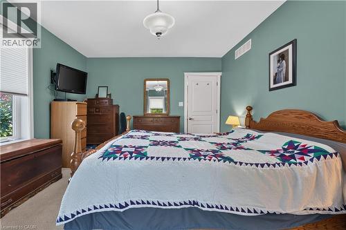Spacious room featuring neutral wall tones and carpet flooring - 42841 Highway 3, Wainfleet, ON 