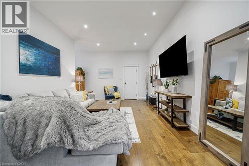 Recessed lighting illuminates wood-finish flooring - 28 Cambridge Street, Cambridge, ON 