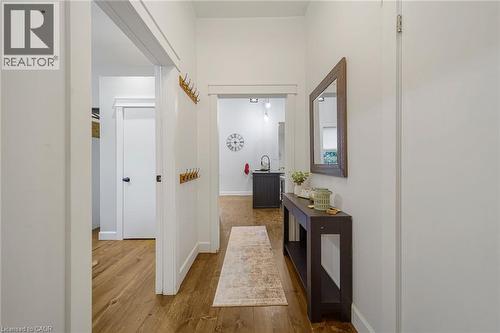 Wood-finish flooring throughout, bright white walls, and a recessed ceiling - 28 Cambridge Street, Cambridge, ON 