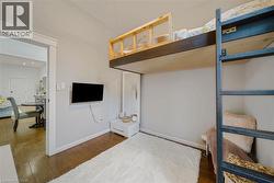 Wood-finish flooring with a light gray wall color - 