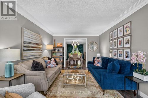 Living room connecting to the formal dining room - 28 Arbour Glen Drive, St. Catharines (Grapeview), ON 