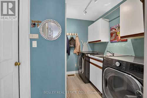 Main floor laundry room & access to garage - 28 Arbour Glen Drive, St. Catharines (Grapeview), ON 