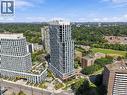 Modern high-rise residential building featuring multiple balconies, a structured facade, and integrated ground-level landscaping - 60 Central Park Roadway Unit# 2010, Etobicoke, ON 