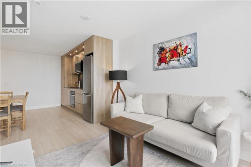 Integrated kitchen featuring wood-finish cabinetry, stainless steel appliances, and recessed lighting - 60 Central Park Roadway Unit# 2010, Etobicoke, ON 