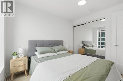 Recessed lighting, wood-finish flooring, sliding mirrored closet doors, and light-colored walls - 60 Central Park Roadway Unit# 2010, Etobicoke, ON 