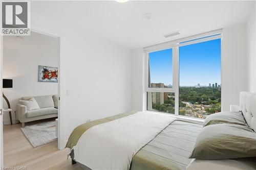 Hardwood flooring, white walls, and a large window with roller shades - 60 Central Park Roadway Unit# 2010, Etobicoke, ON 