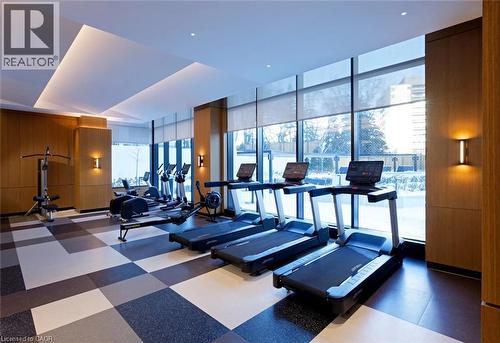 Fitness center with full-height windows, recessed lighting, wood-finish wall panels, and checkerboard floor tiling - 60 Central Park Roadway Unit# 2010, Etobicoke, ON 