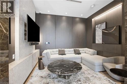 Architectural feature wall, wood-finish wall panels, recessed ceiling lighting, wall-mounted display, and light wood-finish flooring - 60 Central Park Roadway Unit# 2010, Etobicoke, ON 