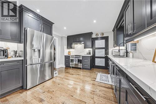 quartz counter top and backsplash, newer appliances, this is a kitchen that you will enjoy to create culinary masterpiece - 581 Holly Hill Crescent, Burlington, ON 