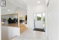From foyer, you step up to inviting living spaces - 