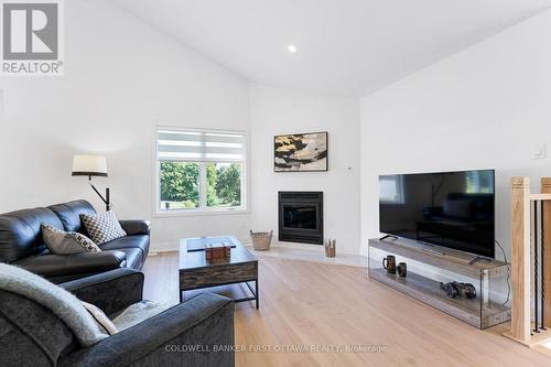 Modern efficient fireplace has wood-burning insert - 268 Boyds Road, Lanark Highlands, ON 