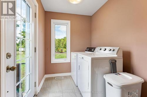 Main floor laundry room with conveniend side door - 8688 Highway 511, Lanark Highlands, ON 