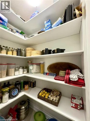 Built-in corner pantry with multiple white shelves - 923 Eaglecrest Court, Kitchener, ON 