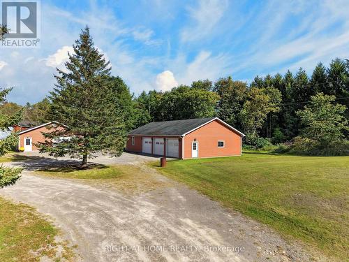 3-Car Garage + Heated Workshop: 58'7\" x 35'3\" - 156 Cooper Road, Madoc, ON 