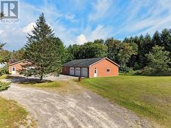 3-Car Garage + Heated Workshop: 58'7\" x 35'3\" - 