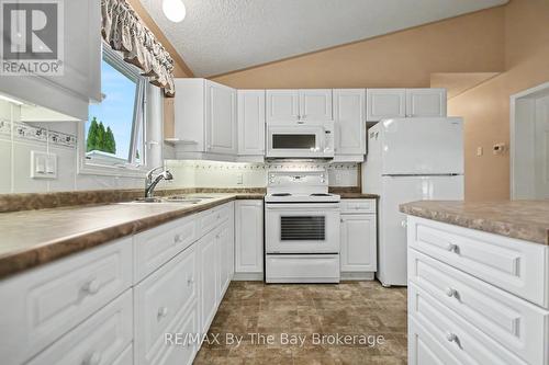 Kitchen Area with Sink Window - 30 St James Place, Wasaga Beach, ON 