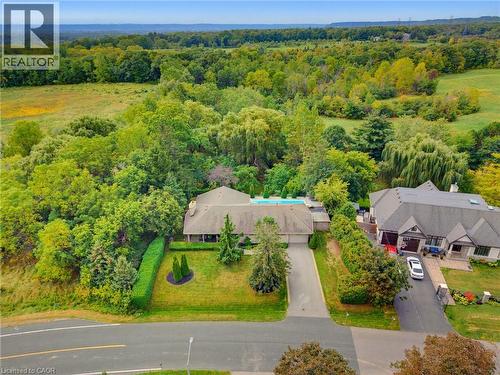 Expansive property featuring a paved driveway, lush green lawns, and mature trees - 1316 Nevarc Drive, Burlington, ON 