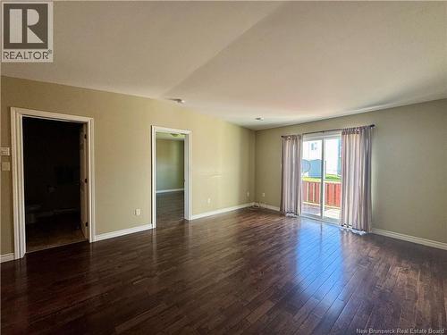 Living room with patio doors to back deck/yard - 26 Acorn Drive, Saint John, NB 