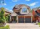Large driveway with two-car garage - 127 Russell Jarvis Drive, Markham, ON 