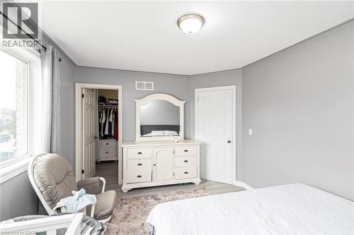 Recessed window, white trim, light gray walls, wood-finish flooring, ceiling-mounted light fixture - 42 Saturn Road, Port Colborne, ON 
