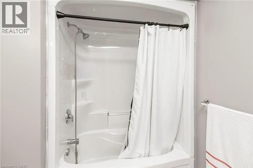 Integrated shower and bathtub unit with chrome fixtures - 42 Saturn Road, Port Colborne, ON 
