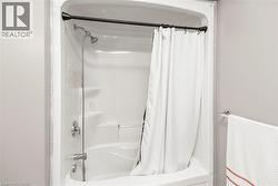 Integrated shower and bathtub unit with chrome fixtures - 