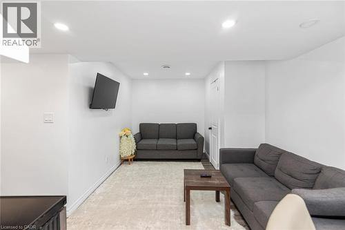Recessed lighting, wood-finish flooring, white walls, and a white door with dark hardware - 42 Saturn Road, Port Colborne, ON 